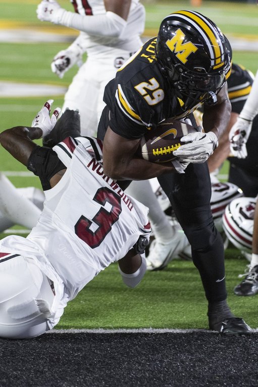 Missouri running back Ahmad Hardy (29) scores a touchdown over South Carolina's Myles Norwood (3) during the second half of an NCAA college football game Saturday, Sept. 20, 2025, in Columbia, Mo. (AP Photo/L.G. Patterson)