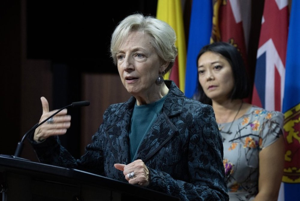 Member of Parliament for Spadina-Harbourfront Chi Nguyen looks on as Shari Graydon of Informed Perspectives responds to a question during a news conference on Parliament Hill on Monday, Sept. 22, 2025 in Ottawa. THE CANADIAN PRESS/Adrian Wyld