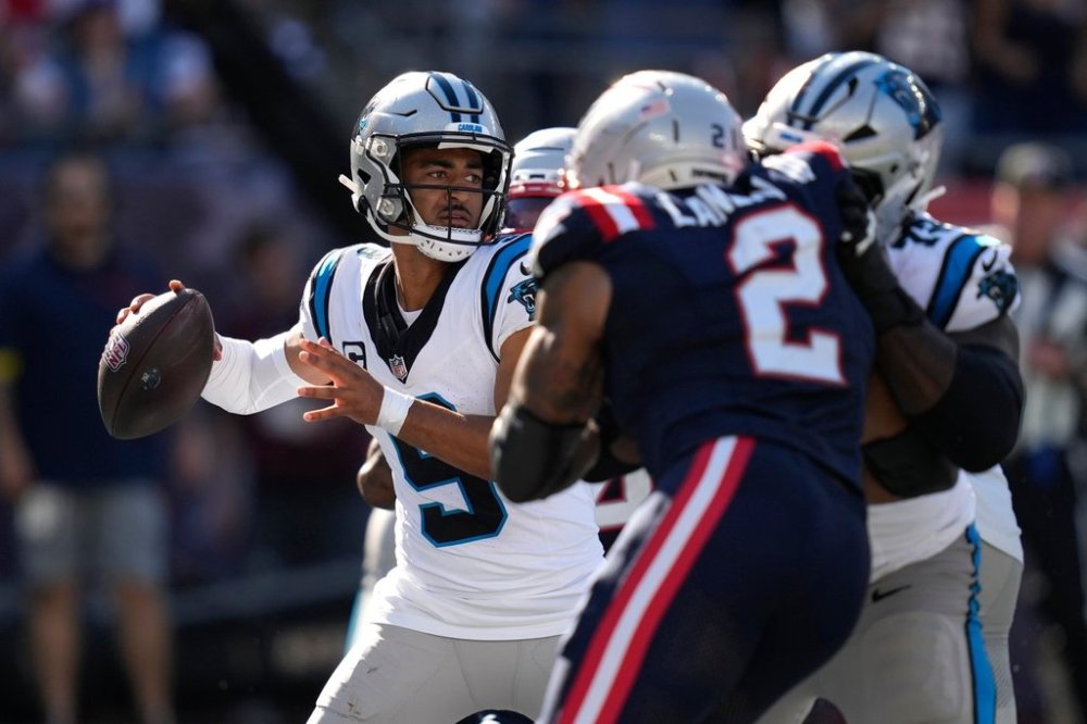 Carolina Panthers quarterback Bryce Young (9) looks to throw a pass against the New England Patriots during the second half of an NFL football game, Sunday, Sept. 28, 2025, in Foxborough, Mass. (AP Photo/Charles Krupa)