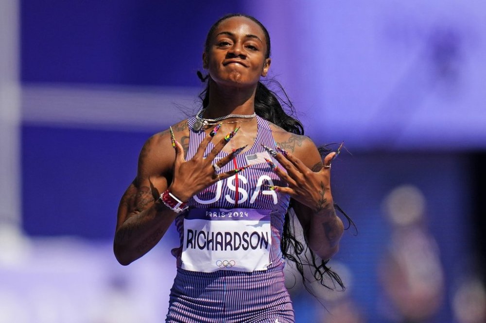 FILE - Sha'carri Richardson of the United States reacts as she wins a heat in the women's 100-meter run at the 2024 Summer Olympics, Friday, Aug. 2, 2024, in Saint-Denis, France. (AP Photo/Petr David Josek, File)