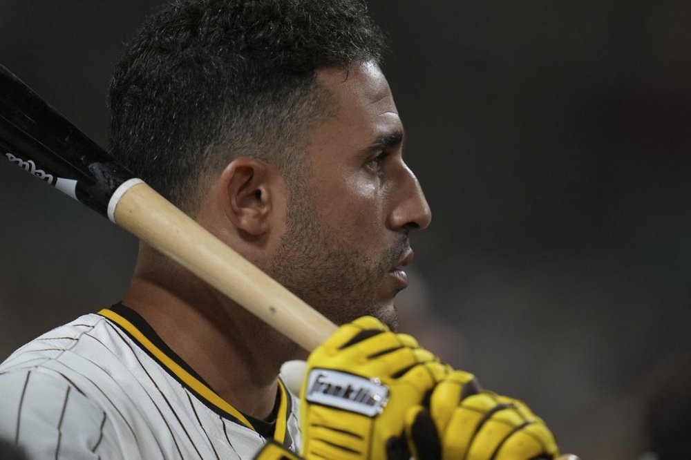San Diego Padres' Ramon Laureano holds a bat as he waits to hit during the fourth inning of a baseball game against the Colorado Rockies Thursday, Sept. 11, 2025, in San Diego. (AP Photo/Gregory Bull)