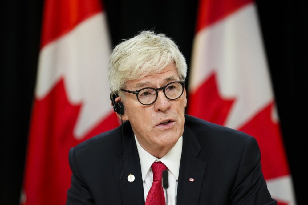 Tim Hodgson, Minister of Energy and Natural Resources, provides an update on the forecast for the 2025 wildfires season at the National Press Theatre in Ottawa on Thursday, June 12, 2025. THE CANADIAN PRESS/Sean Kilpatrick