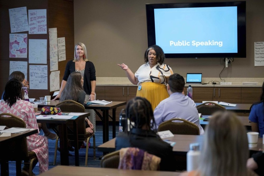 Melissa Watson Ward, training director for Emerge America, center, speaks to present and future candidates for public office taking part in the Emerge America Southern Regional Boot Camp, a camp designed for Democratic women to improve their political campaigns, in New Orleans, Aug. 10, 2025. (AP Photo/Matthew Hinton)