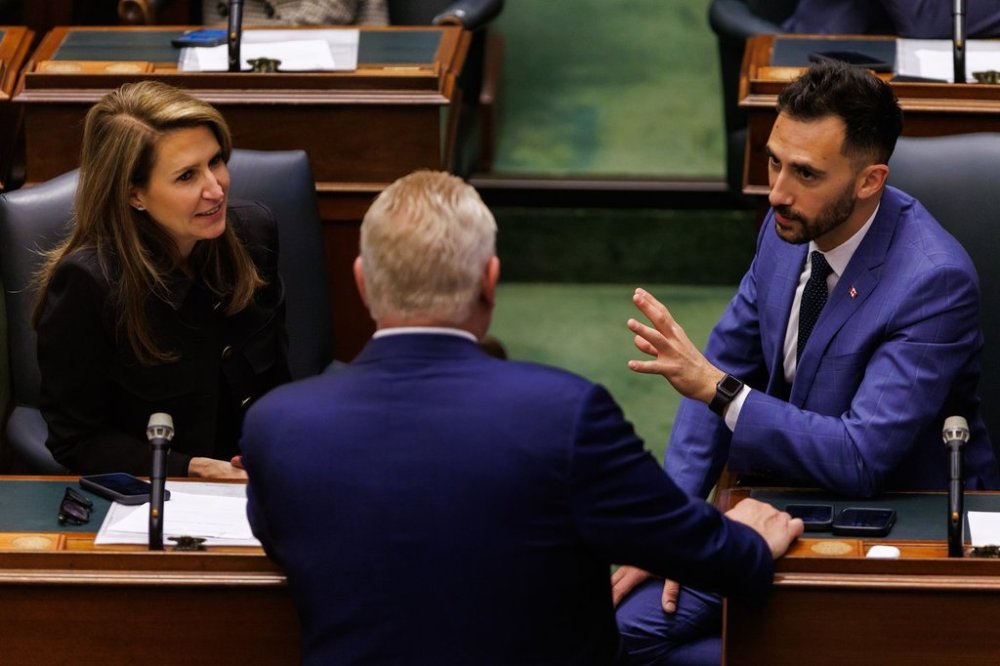 Ontario Premier Doug Ford talks with MPP's Caroline Mulroney, left, and Stephen Lecce, right, ask they wait to elect a new speaker of the Ontario legislature at Queens Park in Toronto, Monday, April 14, 2025. THE CANADIAN PRESS/Cole Burston