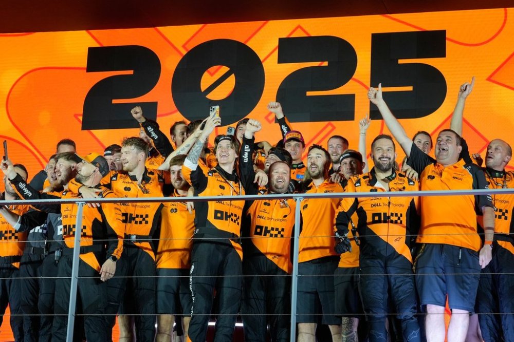 Team McLaren celebrates after winning the constructor's title during the Singapore Formula One Grand Prix at the Marina Bay Street Circuit in Singapore, Sunday, Oct. 5, 2025. (AP Photo/Vincent Thian)