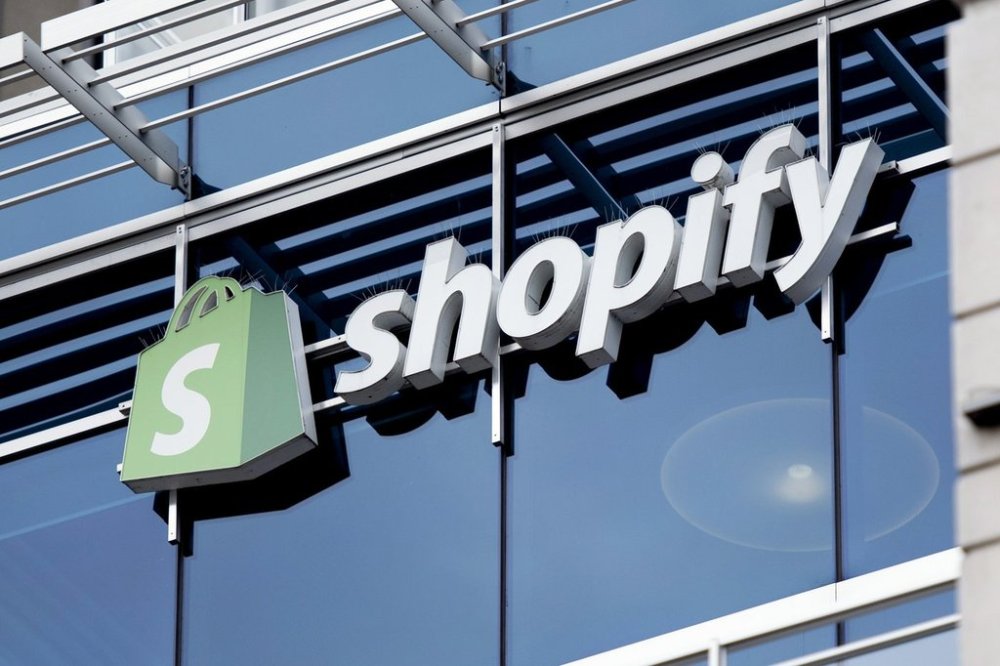 The company logo hangs on the Ottawa headquarters of Canadian e-commerce company Shopify, May 29, 2019. (Justin Tang/The Canadian Press via AP, File)