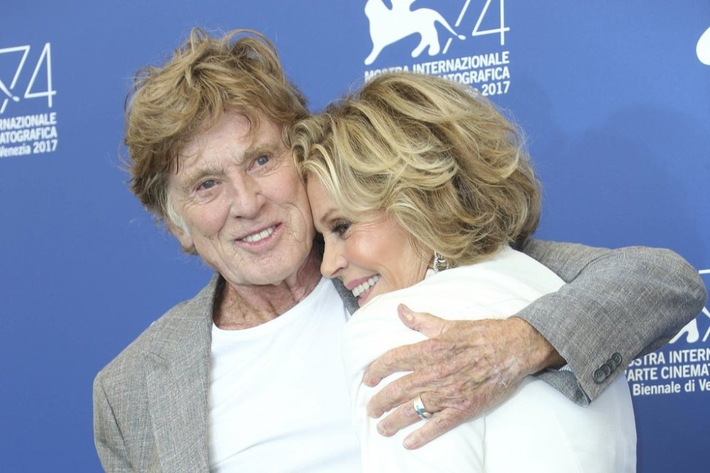 FILE - Actors Robert Redford and Jane Fonda hug as they pose for photographers at the photo call of the film