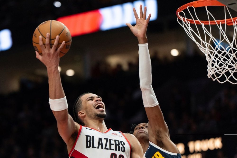 FILE - Portland Trail Blazers guard Scoot Henderson (00) shoots during the second half of an NBA basketball game against the Denver Nuggets, March 21, 2025, in Portland, Ore. (AP Photo/Jenny Kane, File)