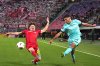 Bologna's Nicolo Cambiaghi, right, kicks the ball past Freiburg's Philipp Treu during the Europa League, opening phase soccer match between Bologna and Freiburg at the Renato Dall'Ara Stadium in Bologna, Italy, Thursday, Oct. 2, 2025. (Massimo Paolone/LaPresse via AP)