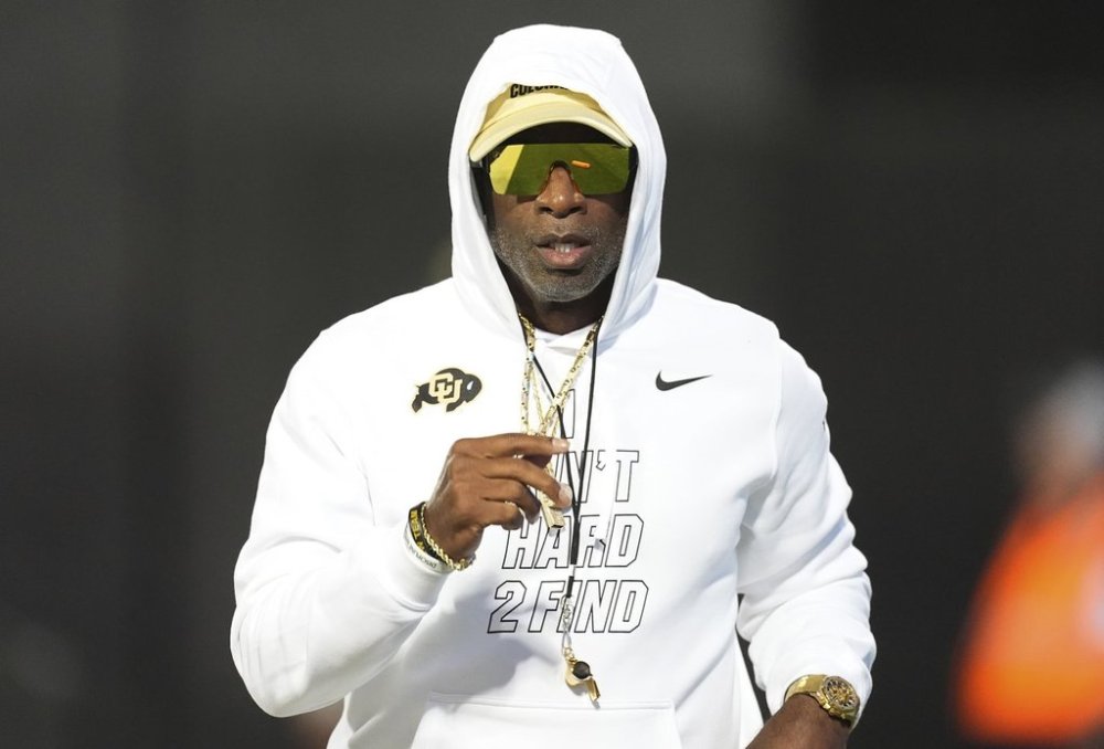 Colorado head coach Deion Sanders walks the perimeter of the field before an NCAA college football game against Wyoming, Saturday, Sept. 20, 2025, in Boulder, Colo. (AP Photo/David Zalubowski)