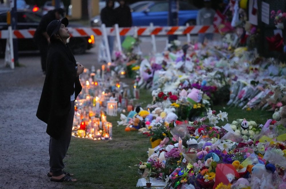 Jyn San Miguel sings a song at a memorial during a vigil on a provincial day of mourning for the victims of the vehicle-ramming attack at the Filipino community's Lapu Lapu Day festival last week, in Vancouver, on Friday, May 2, 2025. THE CANADIAN PRESS/Darryl Dyck