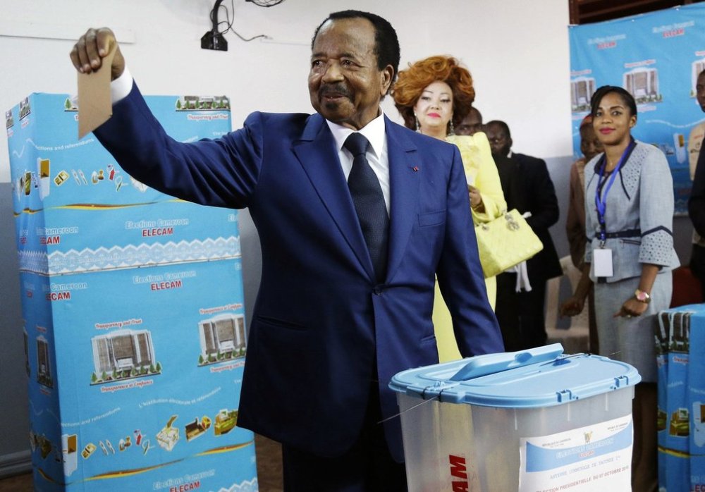 FILE - Cameroon's incumbent President Paul Biya, of the Cameroon People's Democratic Movement party, casts his vote during the presidential elections in Yaounde, Cameroon, Sunday Oct. 7, 2018. (AP Photo/Sunday Alamba, File)