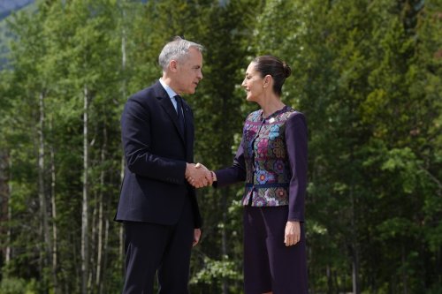 Prime Minister Mark Carney greets Mexican President Claudia Sheinbaum at the G7 Summit in Kananaskis, Alta., on Tuesday, June 17, 2025. THE CANADIAN PRESS/Adrian Wyld
