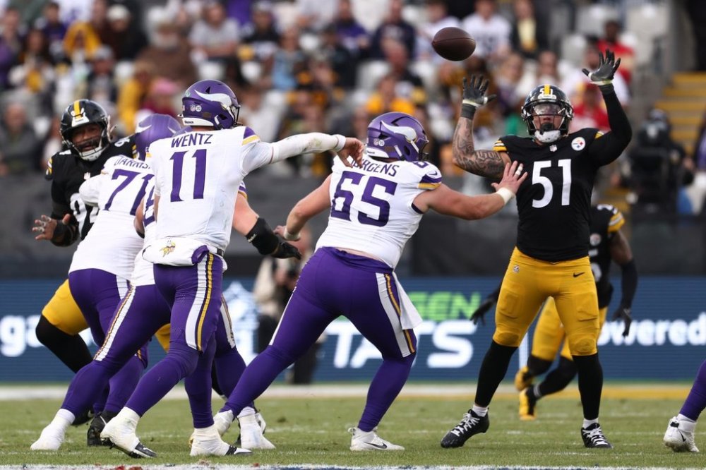 Pittsburgh Steelers linebacker Nick Herbig (51) tries to catch a throw by Minnesota Vikings quarterback Carson Wentz (11) during the NFL football game between Minnesota Vikings and Pittsburgh Steelers at Croke Park stadium in Dublin, Sunday, Sept. 28, 2025.(AP Photo/Peter Morrison)