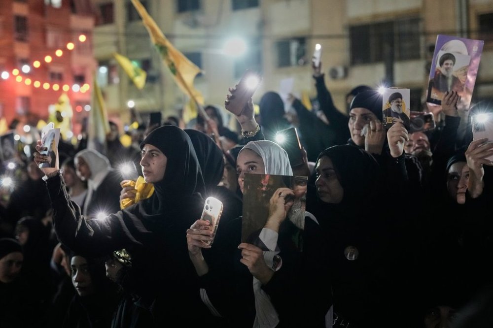 People gather at the site where Hezbollah leader Hassan Nasrallah was killed in Israeli airstrikes on Sept. 27, 2024, a day before the first anniversary of his death, in the Haret Hreik suburb south of Beirut, Lebanon, Friday, April 26, 2025. (AP Photo/Hassan Ammar)