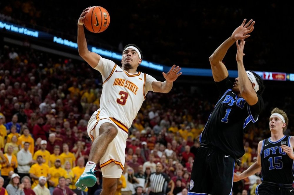 FILE - Iowa State guard Tamin Lipsey (3) drives to the basket past BYU guard Trey Stewart (1) during overtime in an NCAA college basketball game, March 4, 2025, in Ames, Iowa. (AP Photo/Charlie Neibergall, File)