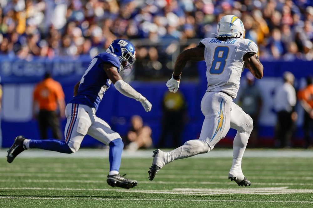 Los Angeles Chargers running back Omarion Hampton (8) carries the ball for a touchdown against the New York Giants during the third quarter of an NFL football game, Sunday, Sept. 28, 2025, in East Rutherford, N.J. (AP Photo/Adam Hunger)