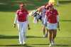 Lauren Coughlin, right, and Lilia Vu of the United States, walk to the first green during the pool A match against China team for the LPGA International Crown golf tournament at the New Korea Country Club in Goyang, South Korea, Thursday, Oct. 23, 2025. (AP Photo/Lee Jin-man)