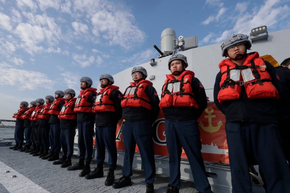 FILE - Deck crew of Taiwanese navy stand by on a Taiwan's domestically made Tuo Chiang patrol ship during a simulated attack drill off Kaohsiung City, southern Taiwan, on Jan. 9, 2025. (AP Photo/Chiang Ying-ying, File)