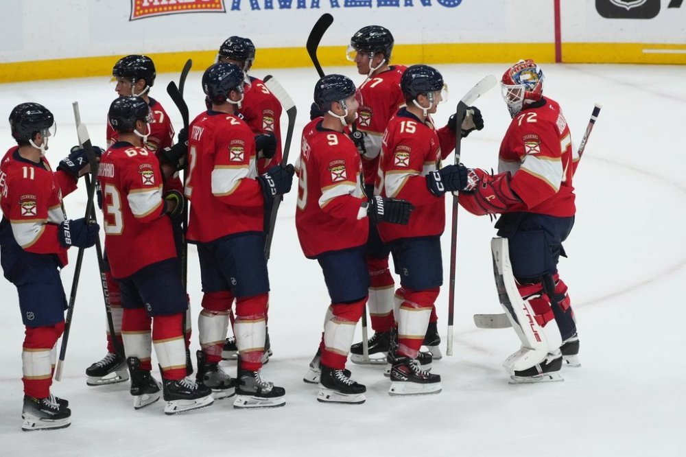 The Florida Panthers celebrate after defeating the Ottawa Senators at an NHL hockey game, Saturday, Oct. 11, 2025, in Sunrise, Fla. (AP Photo/Marta Lavandier)