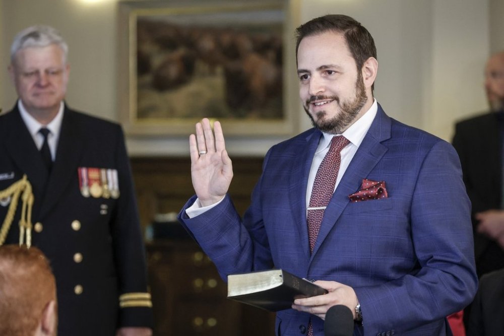New Minister of Education and Childcare, Demetrios Nicolaides, swears the oath of office in Calgary, Alta., Friday, May 16, 2025.THE CANADIAN PRESS/Jeff McIntosh