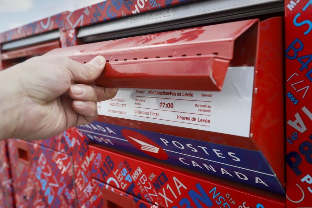Mail and parcel delivery are set to resume this morning on a limited basis as Canada Post workers are back on the job amid rotating strikes. Mailboxes are seen at Canada Post's main plant in Calgary, Alta., Saturday, May 9, 2020. THE CANADIAN PRESS/Jeff McIntosh