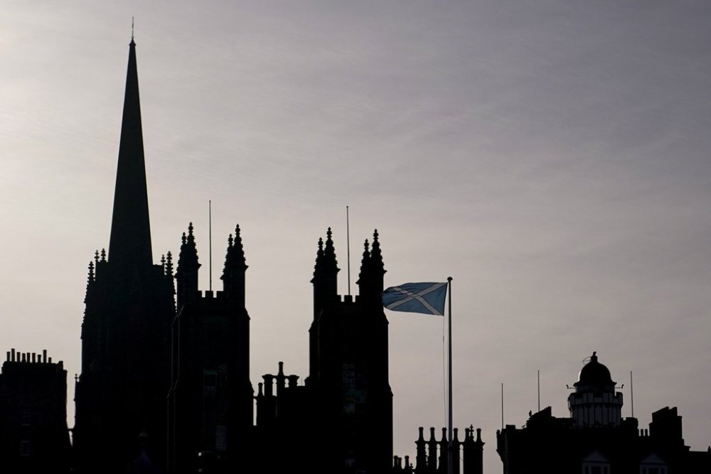 A flag of Scotland flies in Edinburgh, Scotland, Sunday, Nov. 7, 2021. (AP Photo/Alberto Pezzali)