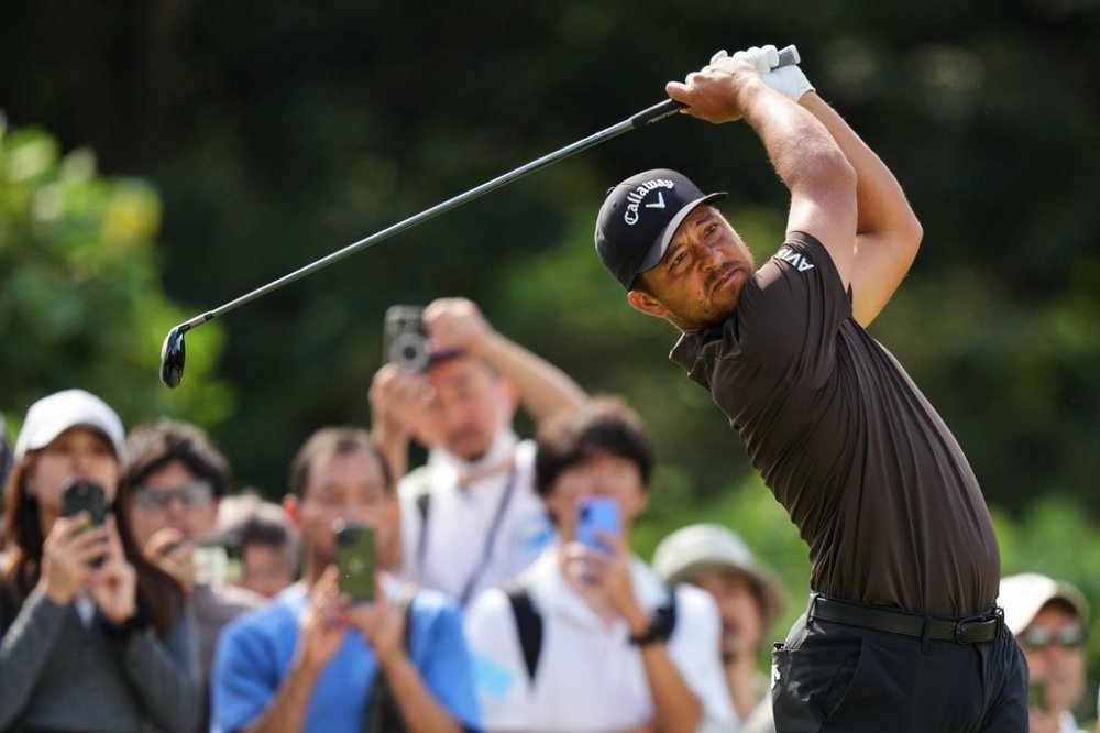 Xander Schauffele, of the U.S., tees off on the second hole during the fourth round of the Baycurrent Classic golf tournament at the Yokohama Country Club in Yokohama, near Tokyo, Sunday, Oct. 12, 2025. (AP Photo/Hiro Komae)