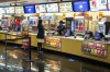 A movie goer stands at the concessions kiosk in the lobby of a Cineplex theatre in Toronto,  on Tuesday, Oct. 6, 2020. THE CANADIAN PRESS/Chris Young