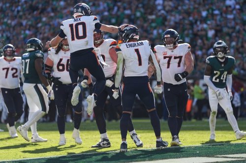 Denver Broncos quarterback Bo Nix (10) celebrates after Broncos tight end Evan Engram (1) scores a touchdown during the second half of an NFL football game against the Philadelphia Eagles on Sunday, Oct. 5, 2025, in Philadelphia. (AP Photo/Matt Rourke)