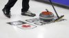 A curling stone passes over a logo during a practice session at the Tim Hortons Brier in Lethbridge, Alta., Friday, March 4, 2022. THE CANADIAN PRESS/Jeff McIntosh