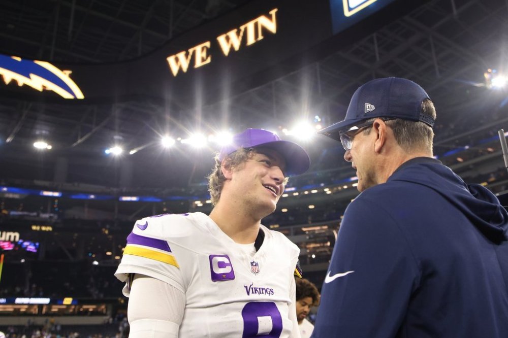 Minnesota Vikings quarterback J.J. McCarthy (9) and Los Angeles Chargers head coach Jim Harbaugh talk after an NFL football game Thursday, Oct. 23, 2025, in Inglewood, Calif. (AP Photo/Jessie Alcheh)