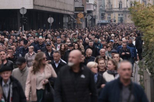 Thousands of people attend the funeral of popular Bosnian folk singer Halid Beslic, who also was also widely known for his humanitarian work during and after the country's bloody 1992-95 war, in Sarajevo, Bosnia, Monday, Oct. 13, 2025. (AP Photo/Armin Durgut)
