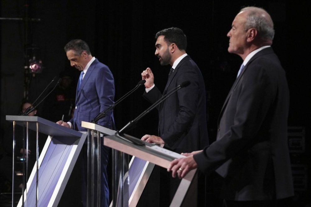 Independent candidate former New York Gov. Andrew Cuomo, Republican candidate Curtis Sliwa and Democratic candidate Assemblyman Zohran Mamdani participate in a second New York City mayoral debate at LaGuardia Performing Arts Center at LaGuardia Community College in the Queens borough of New York, Wednesday, Oct. 22, 2025. (Hiroko Masuike/The New York Times via AP, Pool)