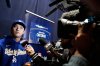 Los Angeles Dodgers star Shohei Ohtani speaks reporters in Toronto on Thursday, Oct. 23, 2025. (AP Photo/Brynn Anderson)