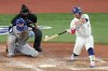 Toronto Blue Jays catcher Alejandro Kirk (30) hits a single during seventh inning Game 7 World Series playoff MLB baseball action against the Los Angeles Dodgers, in Toronto, Saturday, Nov. 1, 2025. THE CANADIAN PRESS/Chris Young