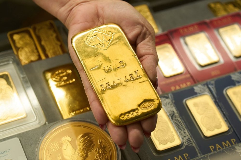 FILE - Sam Nguyen shows a gold bar at her shop in the St. Vincent Jewelry Center in the Jewelry District of Los Angeles, Wednesday, April 30, 2025. (AP Photo/Jae C. Hong, File)