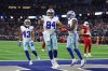 Dallas Cowboys defensive end Marshawn Kneeland (94), Malik Davis (43) and Damone Clark, right, celebrate after Kneeland recovered a blocked punt for a touchdown in the first half of an NFL football game against the Arizona Cardinals Monday, Nov. 3, 2025, in Arlington, Texas. (AP Photo/Richard Rodriguez)