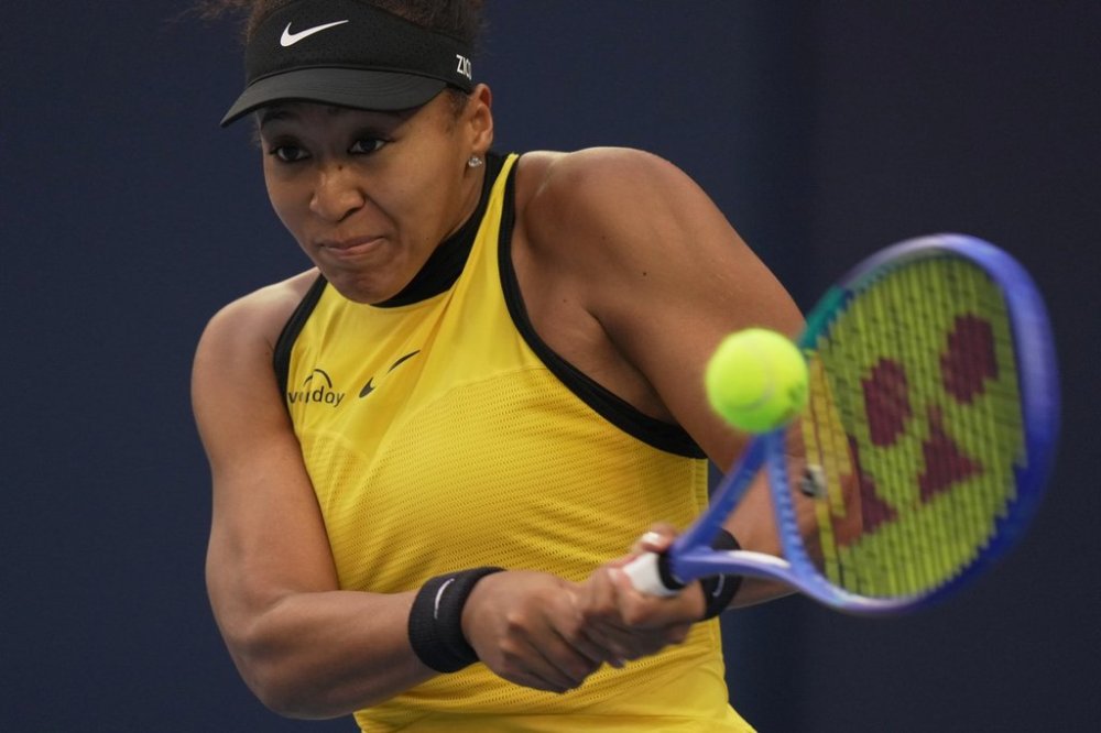Naomi Osaka, of Japan returns a shot from Aliaksandra Sasnovich, of Russia during the women's singles match for the China Open tennis tournament, at the National Tennis Center, in Beijing, Saturday, Sept. 27, 2025. (AP Photo/Andy Wong)