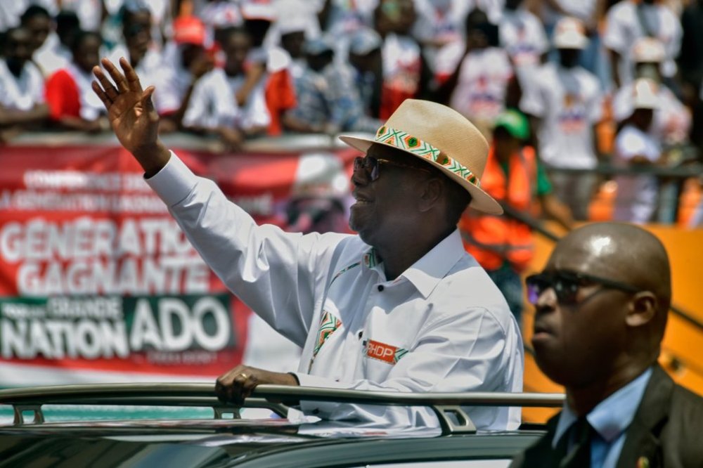 President Alassane Ouattara waves to supporters as he arrives at a campaign rally at the Félix Houphouët-Boigny Stadium in Abidjan, Ivory Coast, Saturday, Oct. 18, 2025. (AP Photo/Diomande Ble Blonde)