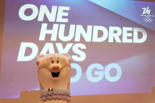 2026 Milan Cortina Winter Olympic podiums are unveiled in Milan, Italy, Wednesday, Oct. 29, 2025, with the mascots Tina and Milo during a press conference marking 100 days to go until the 2026 Milan Cortina Winter Olympics. (AP Photo/Antonio Calanni)