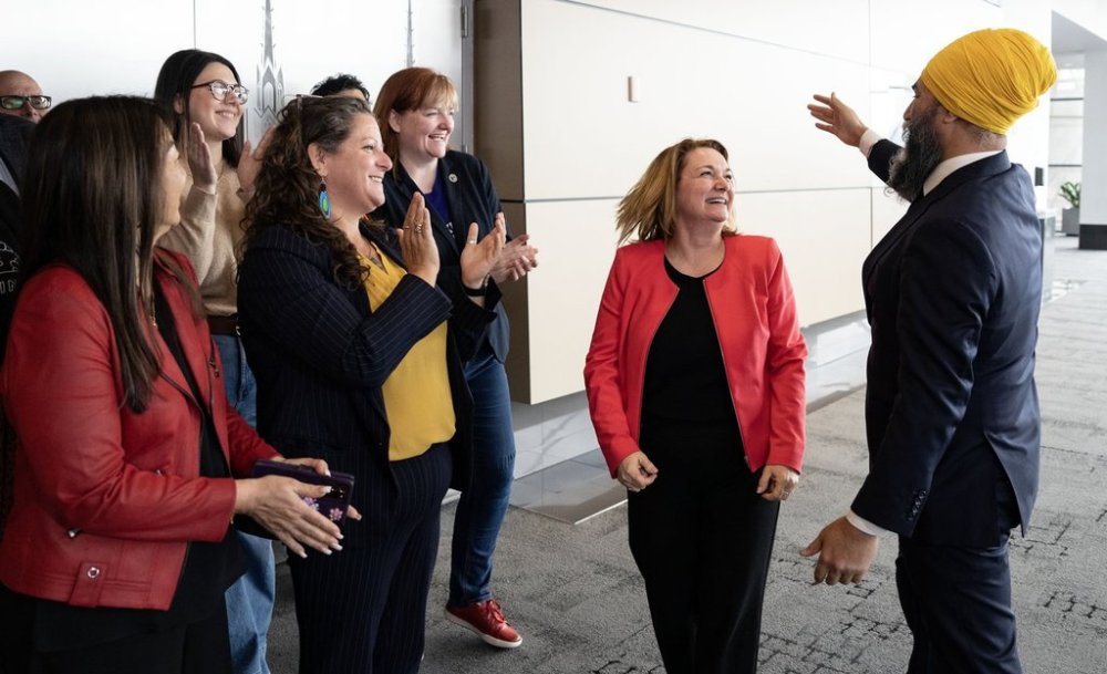 Then NDP leader Jagmeet Singh meets Canadian Labour Congress president Bea Bruske, centre, during a federal election campaign stop in Ottawa on Thursday, April 3, 2025. THE CANADIAN PRESS/Christinne Muschi