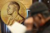 FILE - A visitor reads a book written by South Korean author Han Kang, this year's winner of the Nobel Prize in Literature, at a special section of a bookstore in Seoul, South Korea, Tuesday, Dec. 10, 2024. (AP Photo/Lee Jin-man, File)