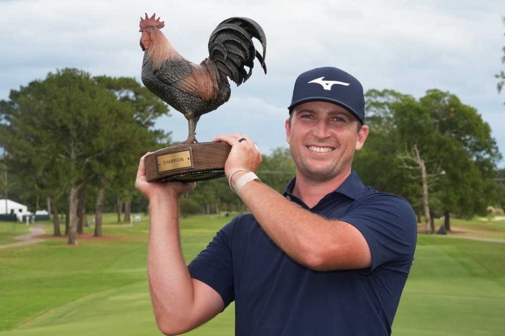 Steven Fisk holds up his trophy after winning the Sanderson Farms Championship golf tournament, Sunday, Oct. 5, 2025, in Jackson, Miss. (AP Photo/Rogelio V. Solis)