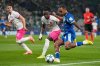 Marseille's Igor Paixao makes an attempt to score past Sporting's Geovany Quenda, centre, and Sporting's Ivan Fresneda during the Champions League opening phase soccer match between Sporting CP and Marseille in Lisbon, Portugal, Wednesday, Oct. 22, 2025. (AP Photo/Armando Franca)