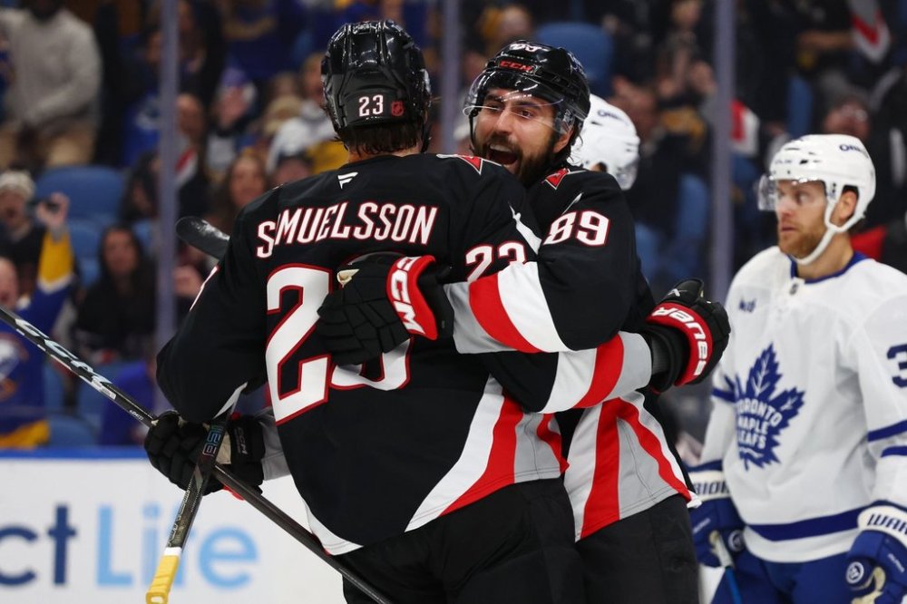Buffalo Sabres defenceman Mattias Samuelsson (23) celebrates after his goal with right wing Alex Tuch (89) during the first period of an NHL hockey game against the Toronto Maple Leafs, Friday, Oct. 24, 2025, in Buffalo, N.Y. (AP Photo/Jeffrey T. Barnes)