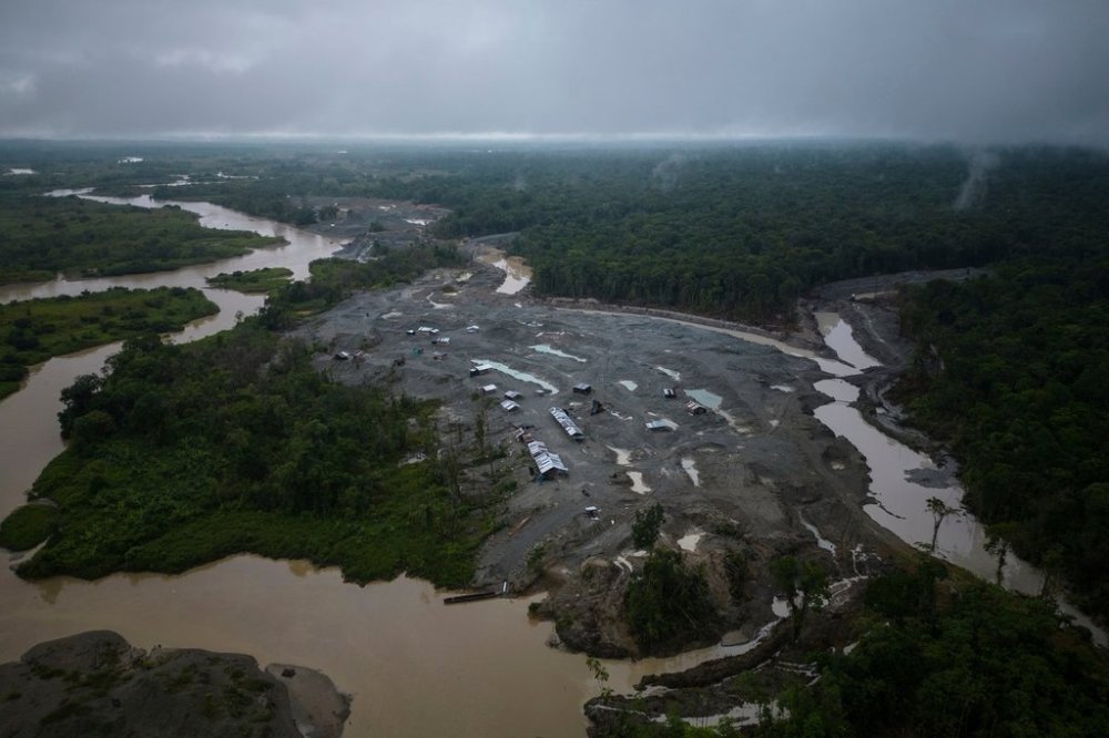 FILE - An illegal mining camp, sits along the Quito River, the Atrato River's main tributary, near Paimado, Colombia, Sept. 23, 2024. (AP Photo/Ivan Valencia, File)