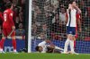 Injured England's Ollie Watkins lays on the ground during an international friendly soccer match between England and Wales at Wembley stadium in London, Thursday, Oct. 9, 2025. (AP Photo/Frank Augstein)