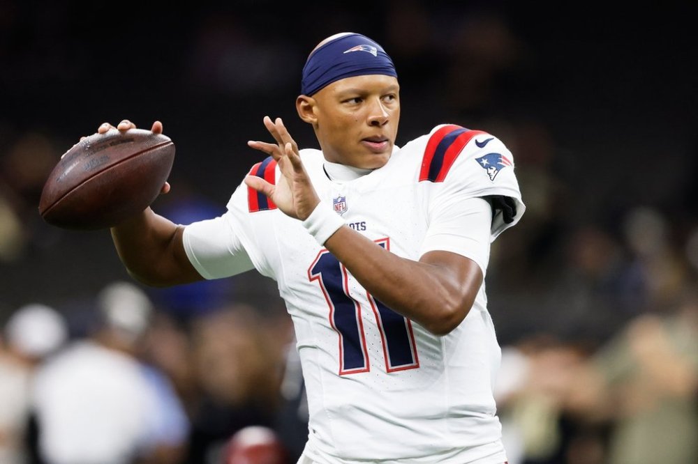New England Patriots quarterback Josh Dobbs warms up before an NFL football game against the New Orleans Saints, Sunday, Oct. 12, 2025, in New Orleans. (AP Photo/Butch Dill)