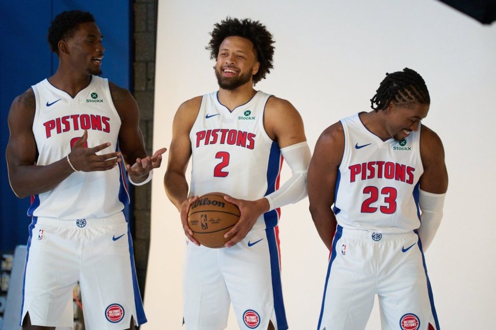 From left; Detroit Pistons center Jalen Duren, and guards Cade Cunningham and Jaden Ivey joke around while posing for a photo during the NBA basketball team's media day, Monday, Sept. 29, 2025, in Detroit. (AP Photo/Ryan Sun)